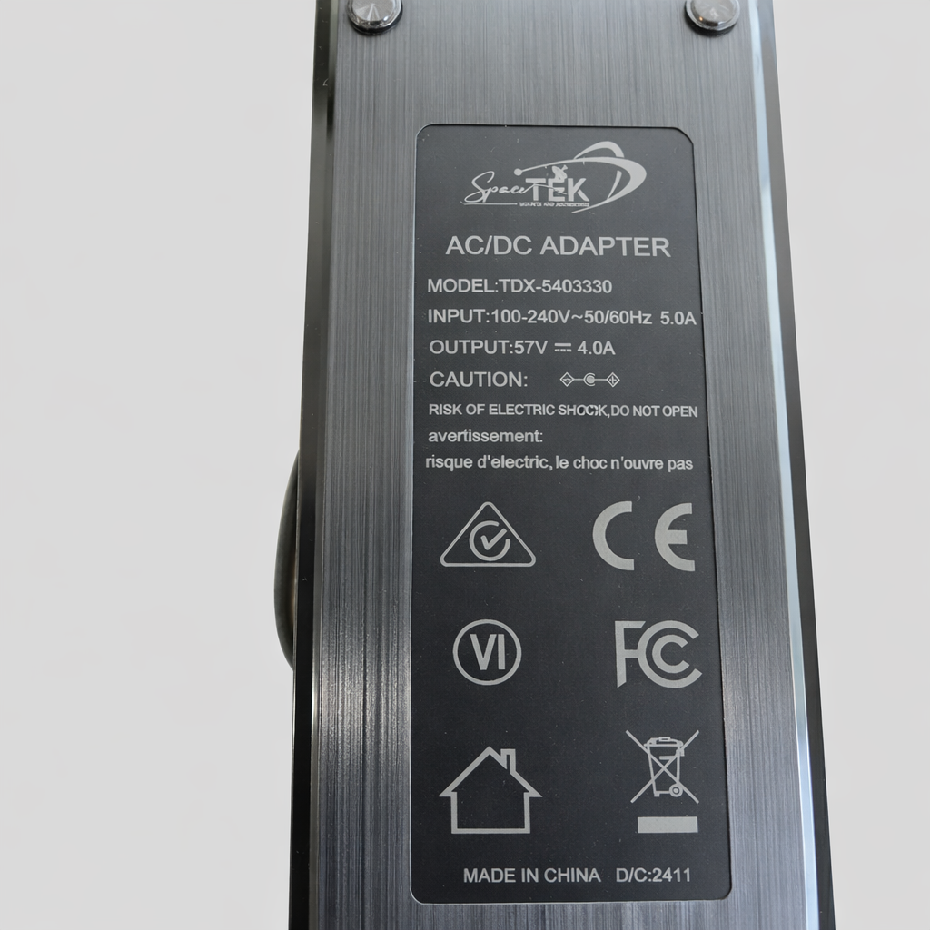 Specification label on 57V 4A AC DC power supply adapter showing model and electrical ratings