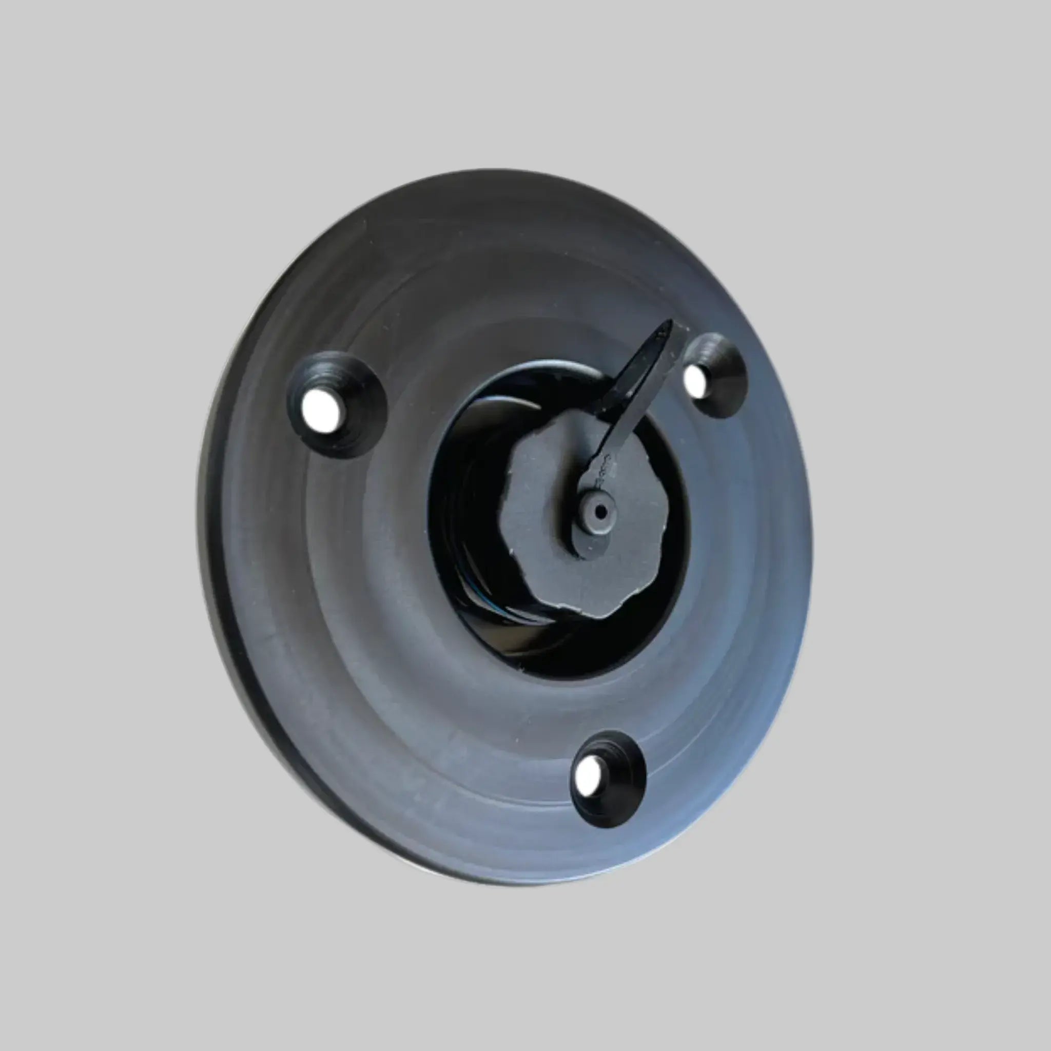 Flush-mounted recessed data socket with circular backing plate, shown with protective cap and mounting holes – ideal for Ethernet or low-voltage data (DC) connections