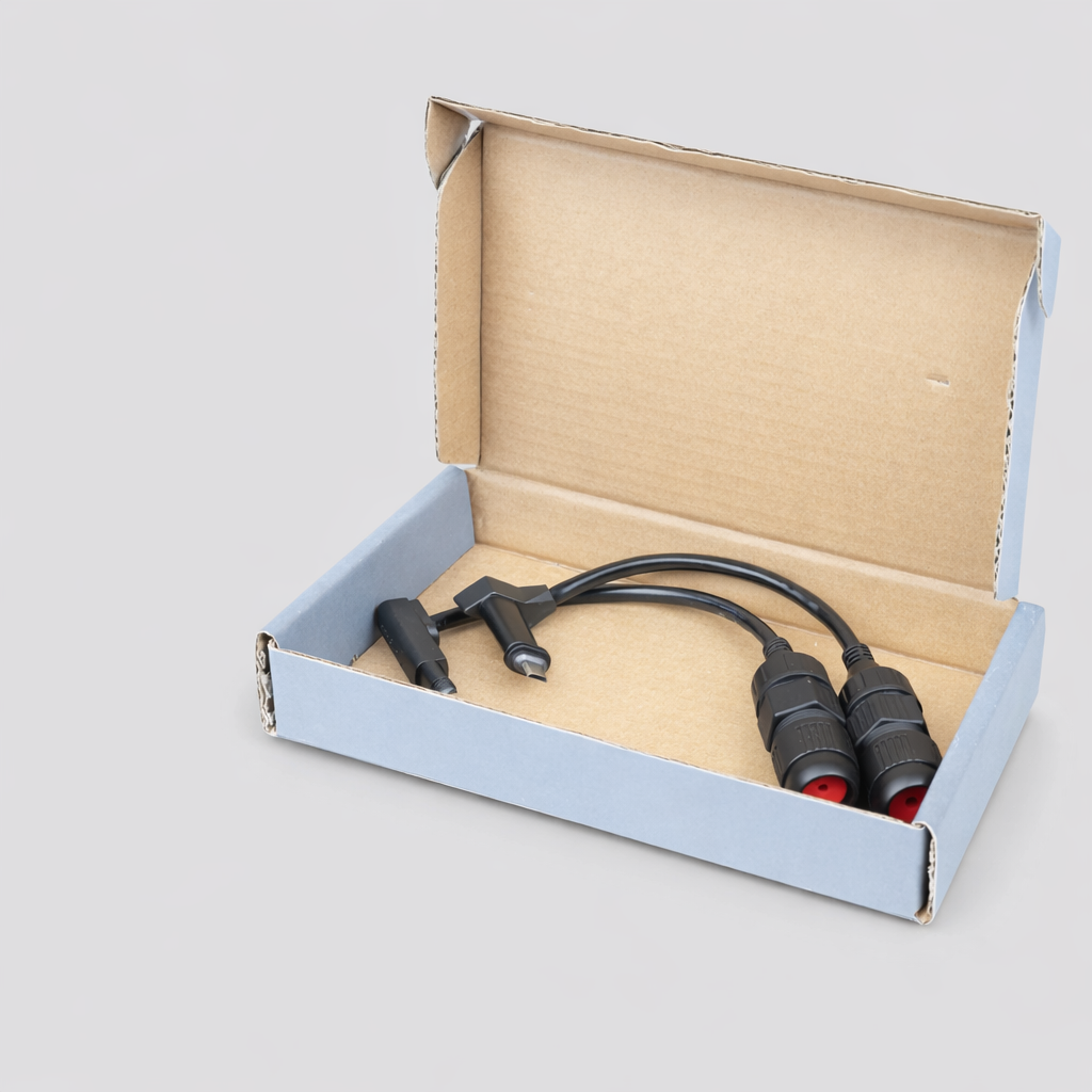 SPX to RJ45 waterproof adaptor for Starlink Gen 2 inside open retail cardboard box — shown coiled and ready for use