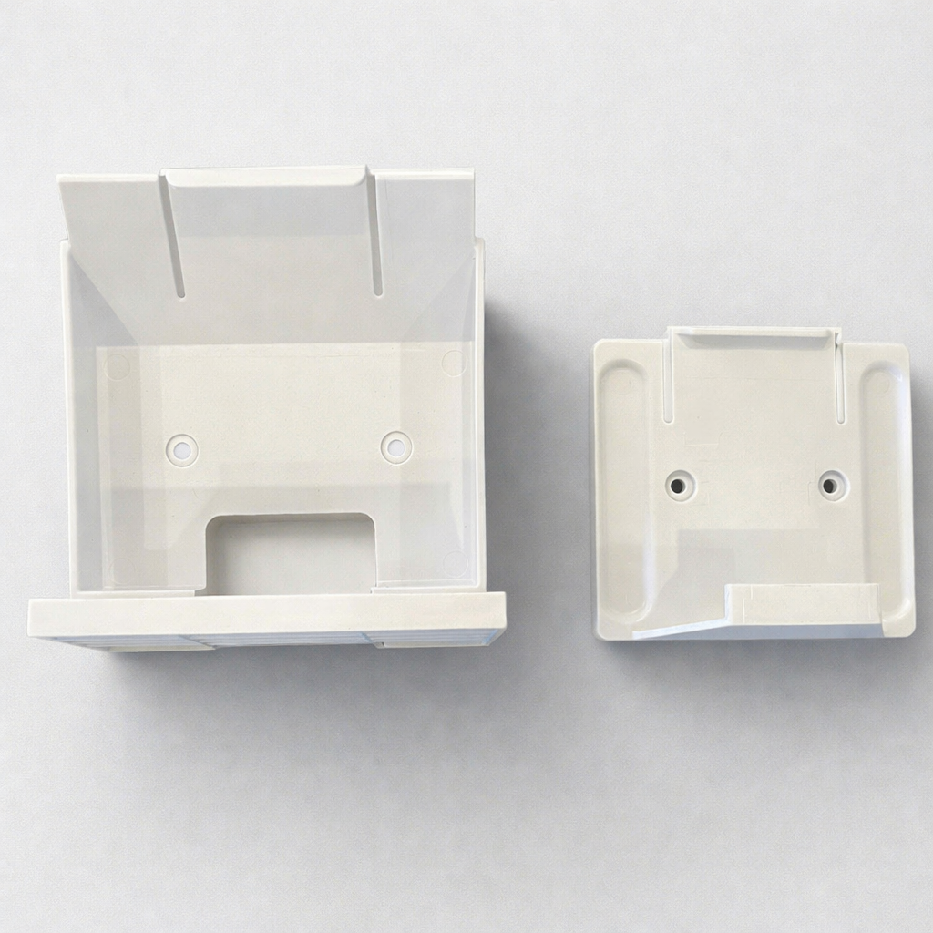 Two plastic Gen 3 wall mountable brackets for Router and Power Supply on grey background