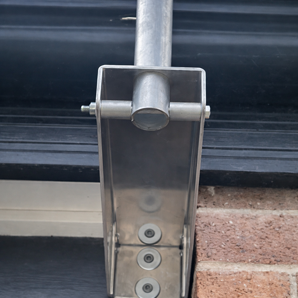 Bottom view of the installed Spacetek Wall/Eave Mount Kit for Starlink Gen 3, showcasing the stainless steel bracket fixed to the brick wall.