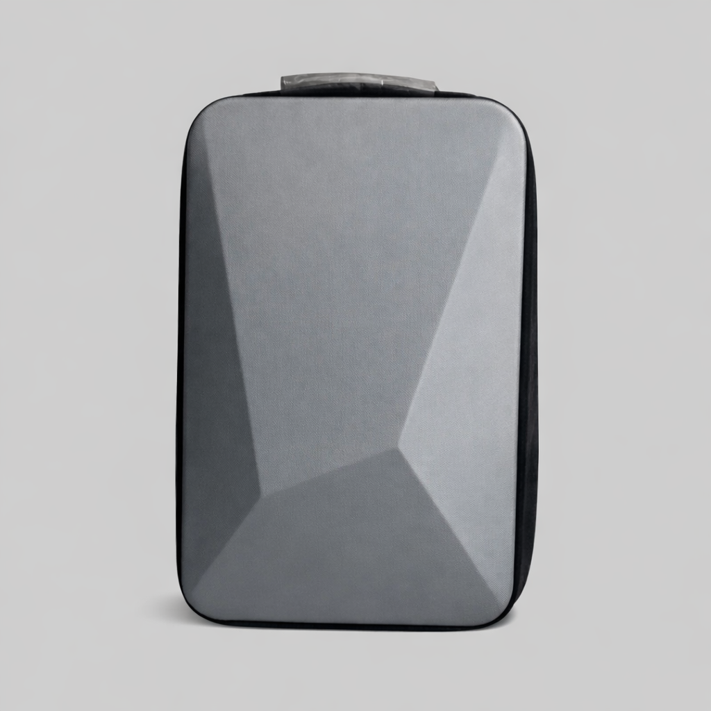 Front view of Spacetek hardshell backpack in matte grey with geometric panel design, ideal for tech travel and minimalist urban style