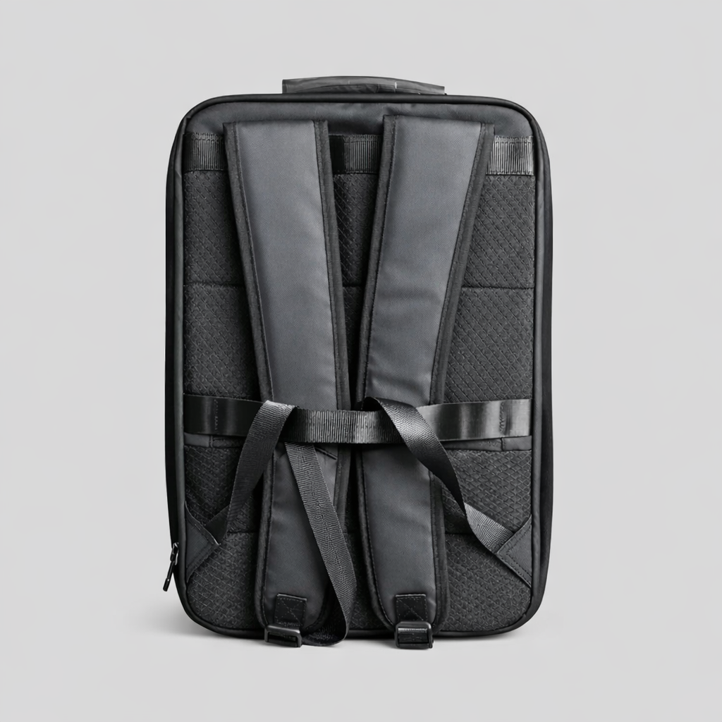 Rear view of Spacetek hardshell backpack showing padded shoulder straps, ergonomic mesh back panel, and adjustable support straps for all-day comfort