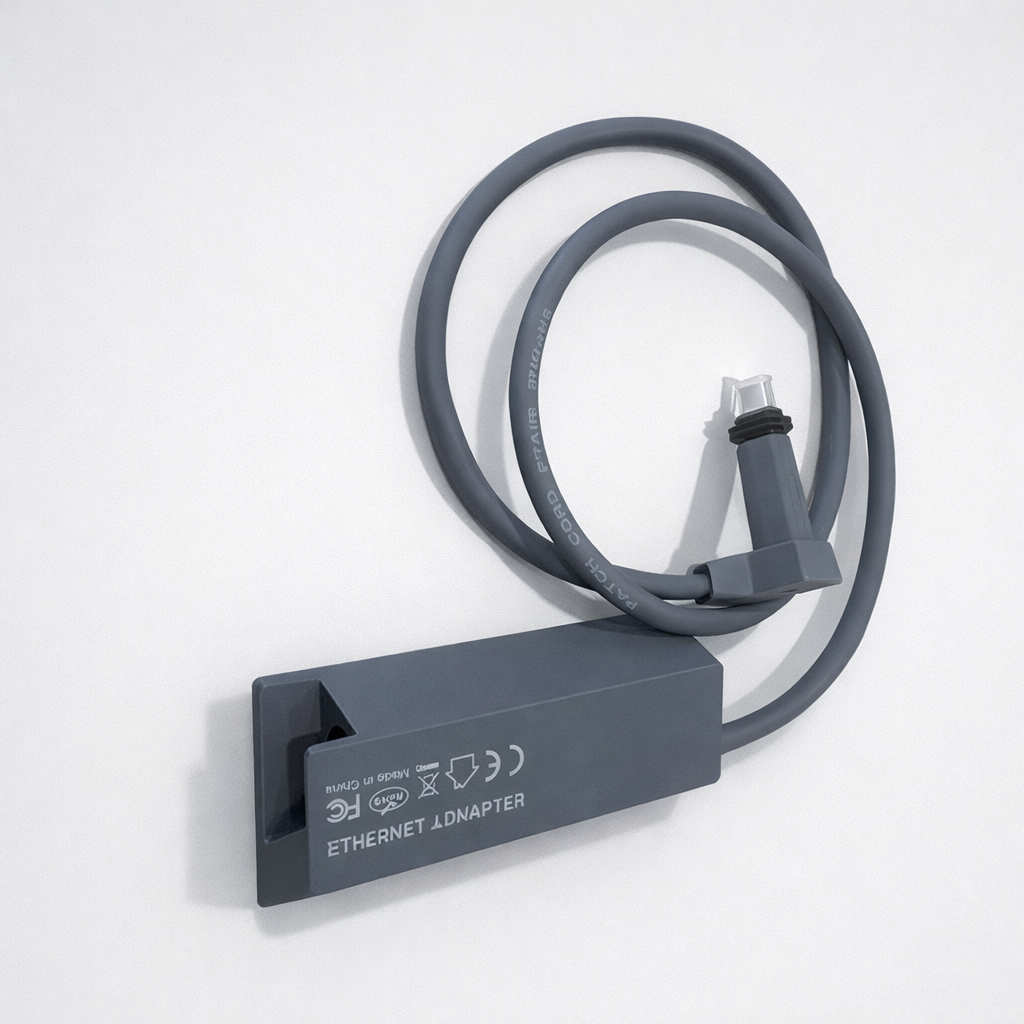 Starlink Gen 2 Ethernet Adapter showing RJ45 port and attached cable, side perspective on light grey background