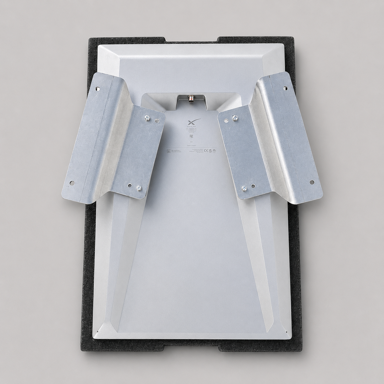 Low-profile view of the raw aluminium flat mount adaptor mounted to a Starlink Gen 3 Performance dish