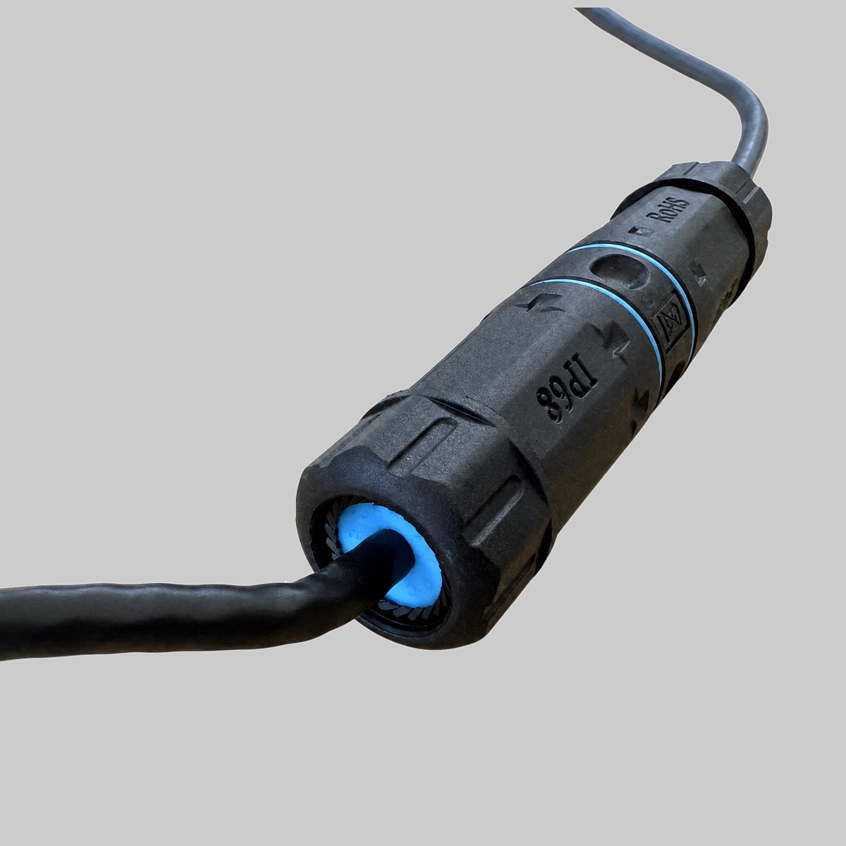 Close detail of the waterproof RJ45 cable joiner cable seal and IP68-marked coupling body