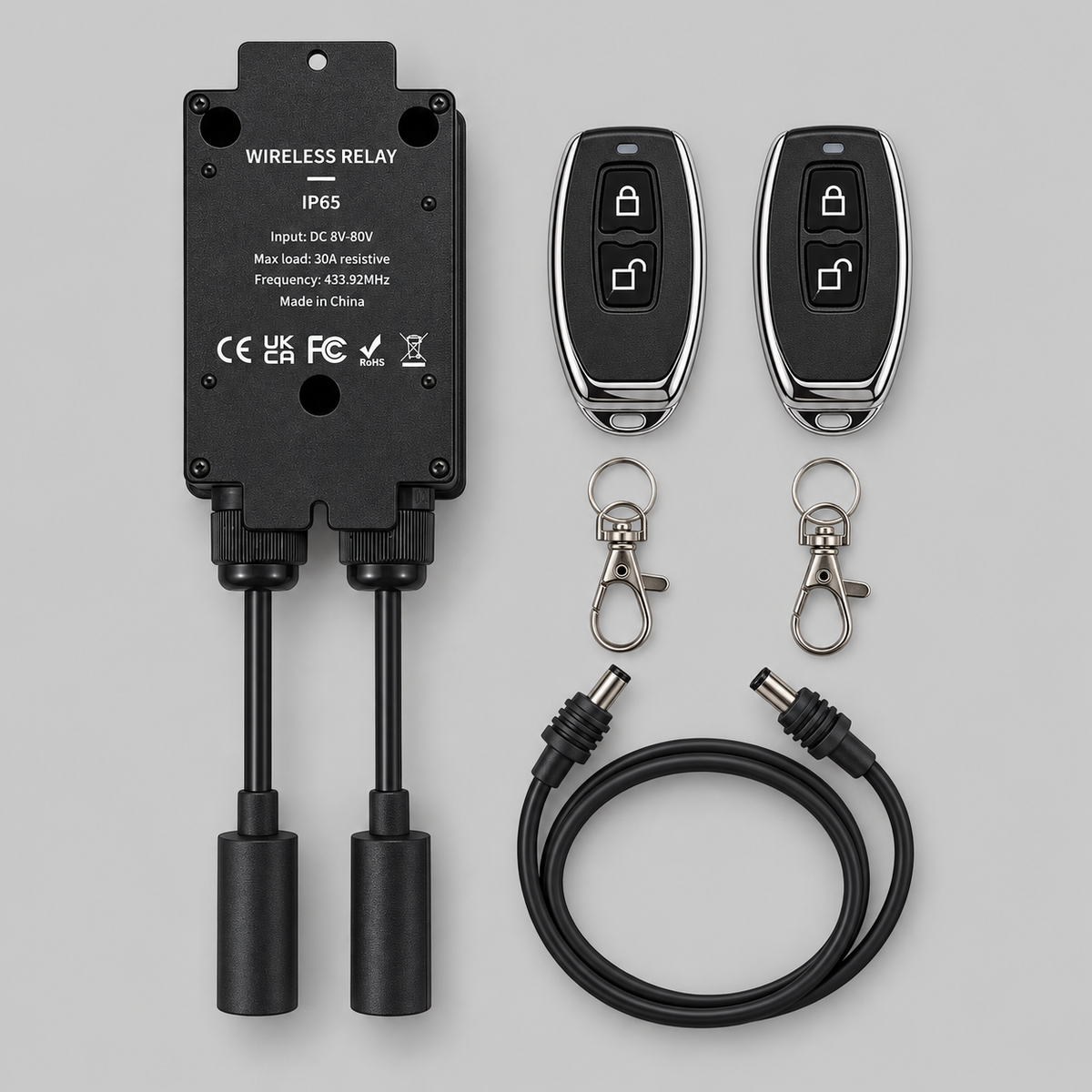 Rear view of Spacetek IP65 waterproof wireless relay showing DC 8–80V label, 30A resistive load rating, mounting holes, cables and remotes