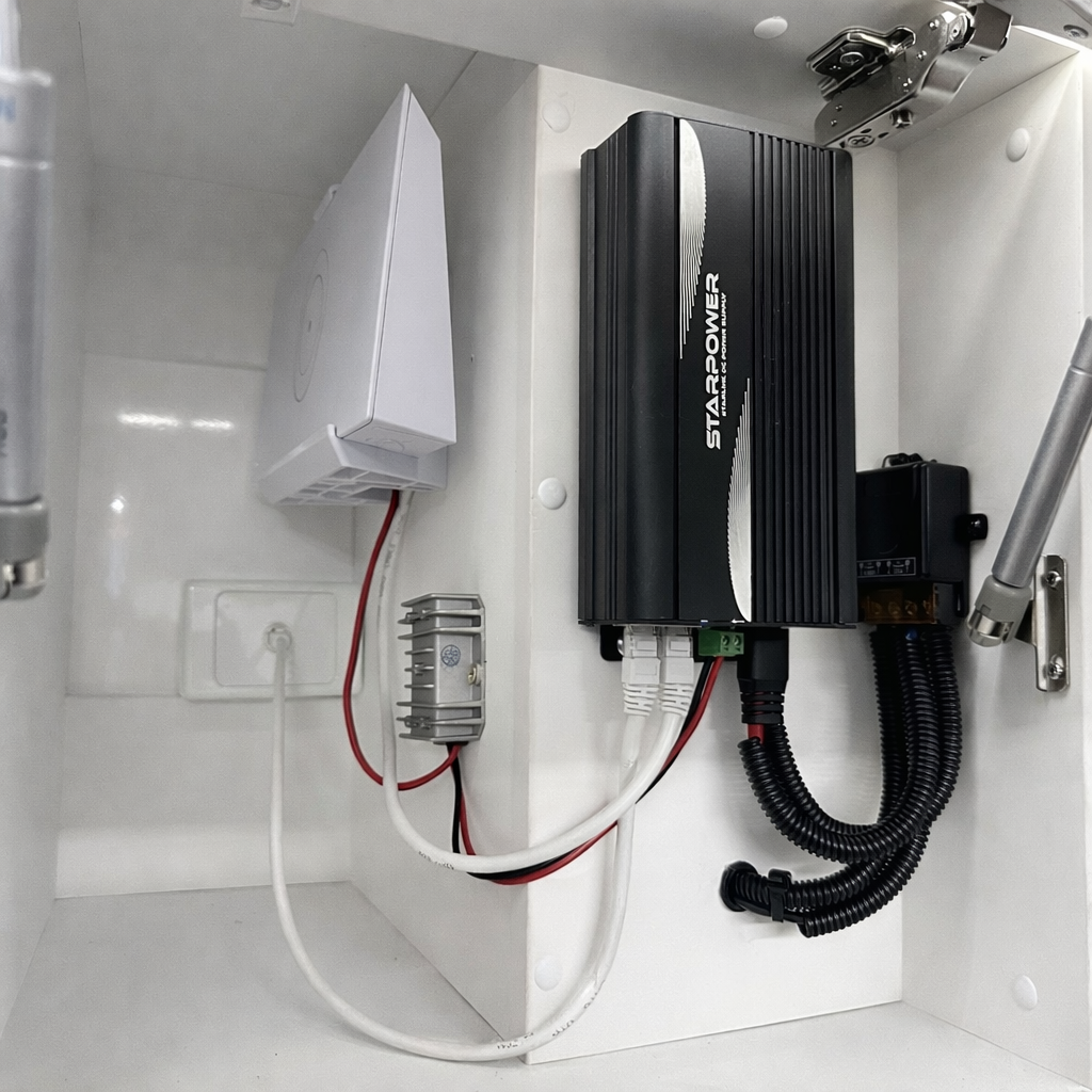 Starpower V2 power system installed inside caravan with Starlink Gen 2 router and 12V booster wiring setup