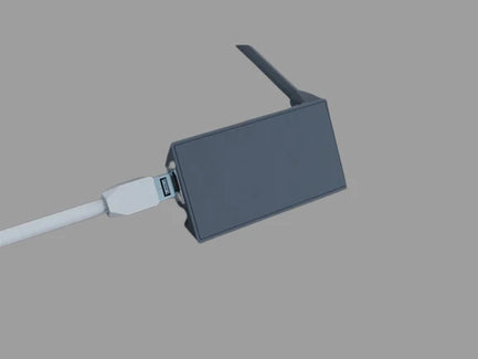 Genuine Starlink Ethernet Adaptor side view with a light background