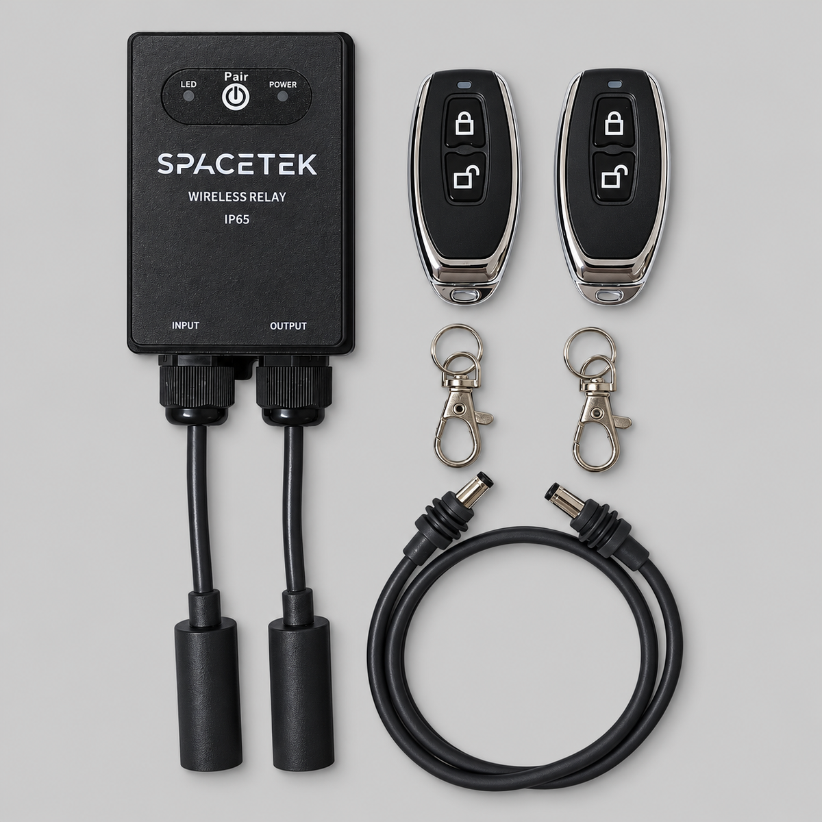 Spacetek IP65 waterproof wireless relay for Starlink Mini and Gen 3, showing relay module, two remote controls, keyrings and DC power cable