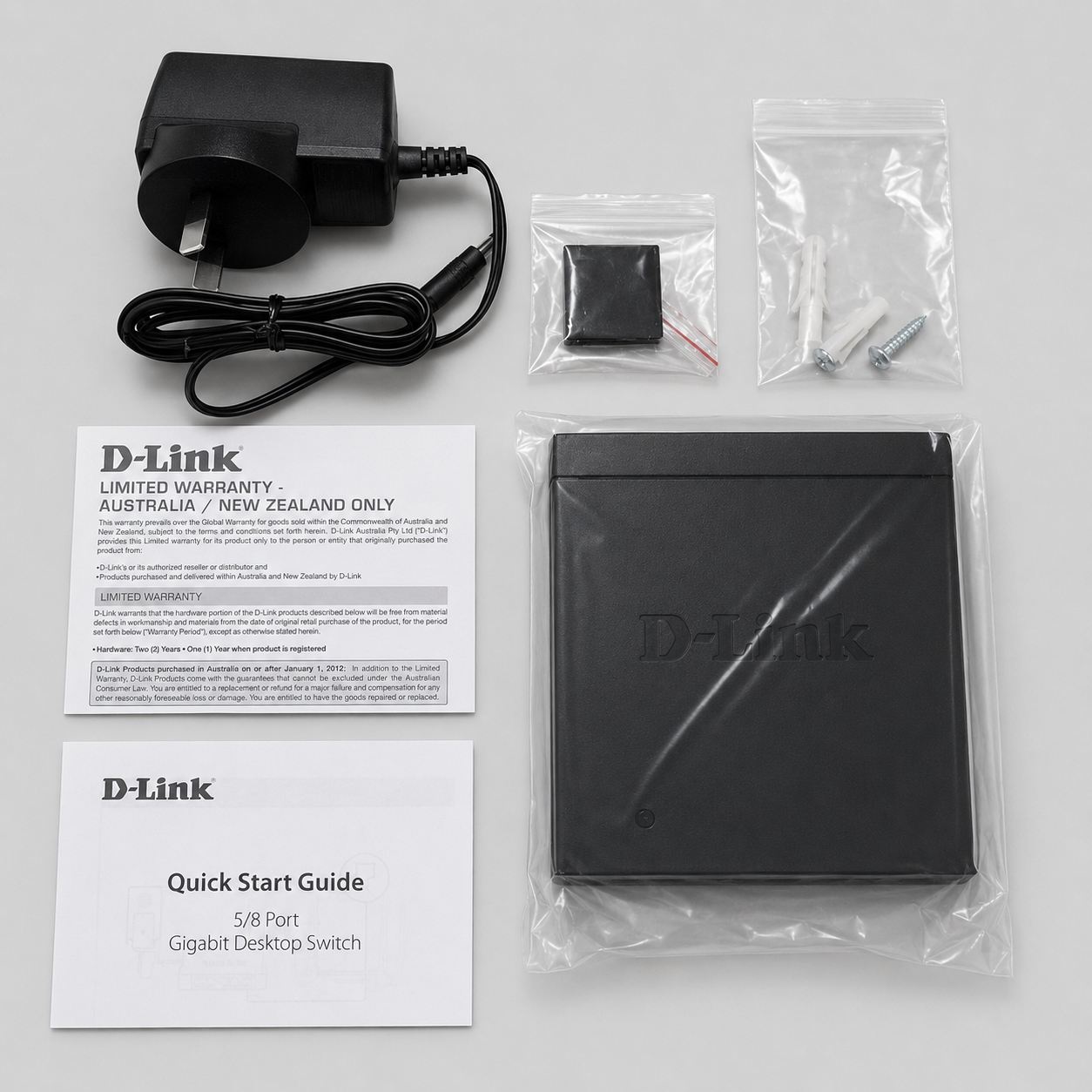 D-Link DGS-105 unmanaged 5 port switch with power adapter, mounting hardware and manuals for Starlink expansion
