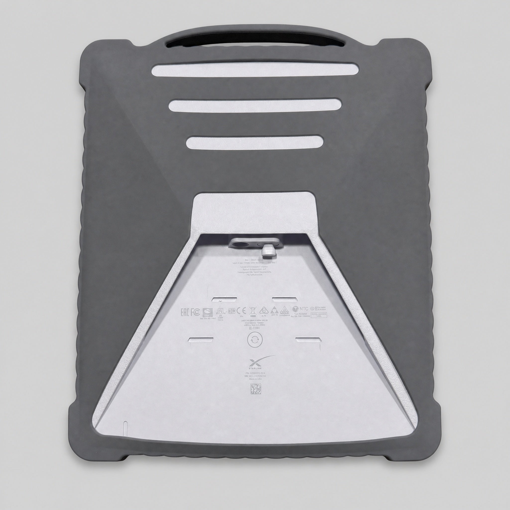 Rear view of grey silicone protective cover fitted to Starlink Mini with carry handle and stand access visible.