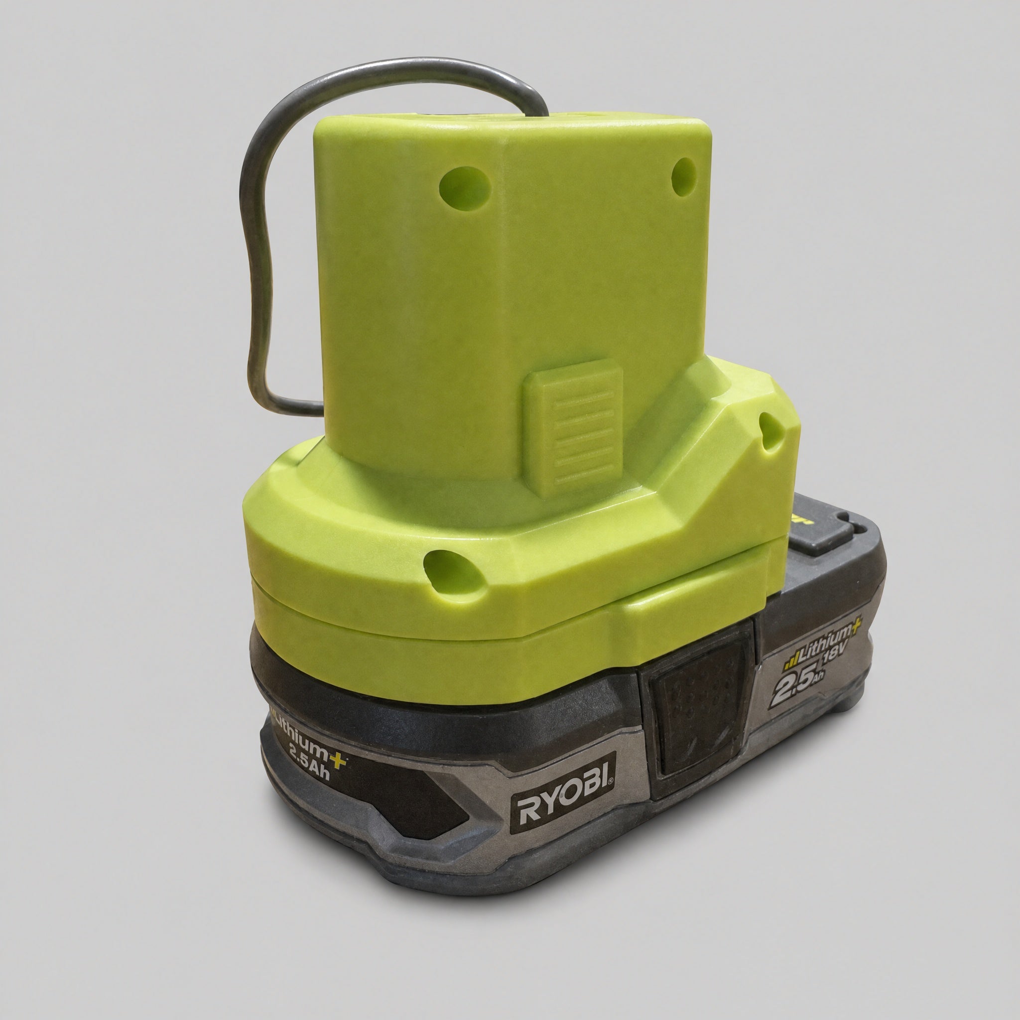 Close-up of Ryobi 18V ONE+ battery adapter for powering Starlink Mini from a portable battery.