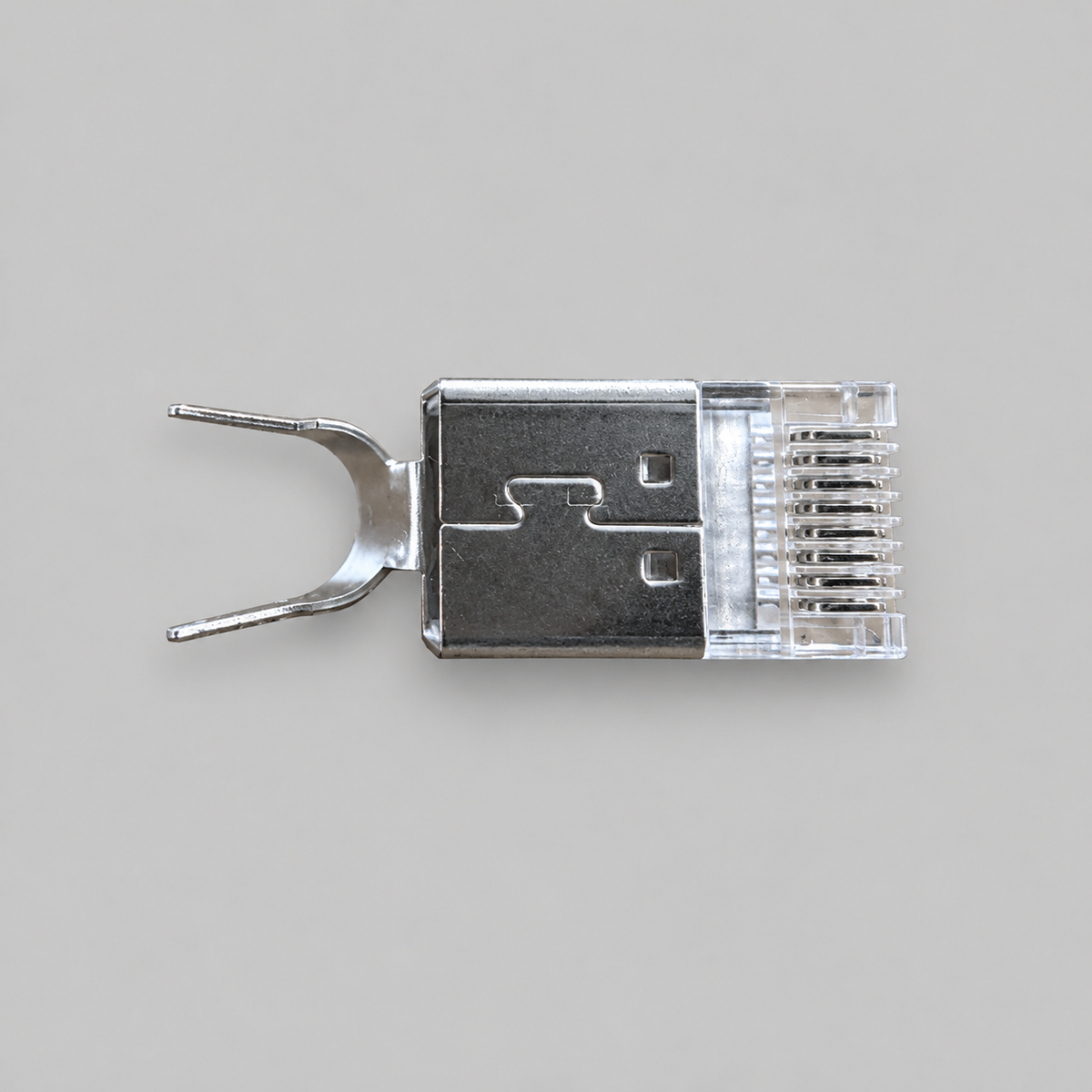 Close-up of a shielded Cat6A RJ45 plug showing metal body and contacts for Starlink cable repair