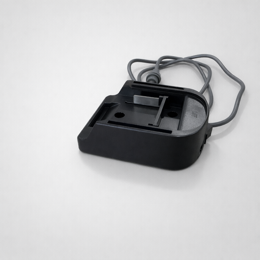 Spacetek Makita battery adaptor for Starlink Mini shown from front angle with integrated power switch and DC cable on light grey background.