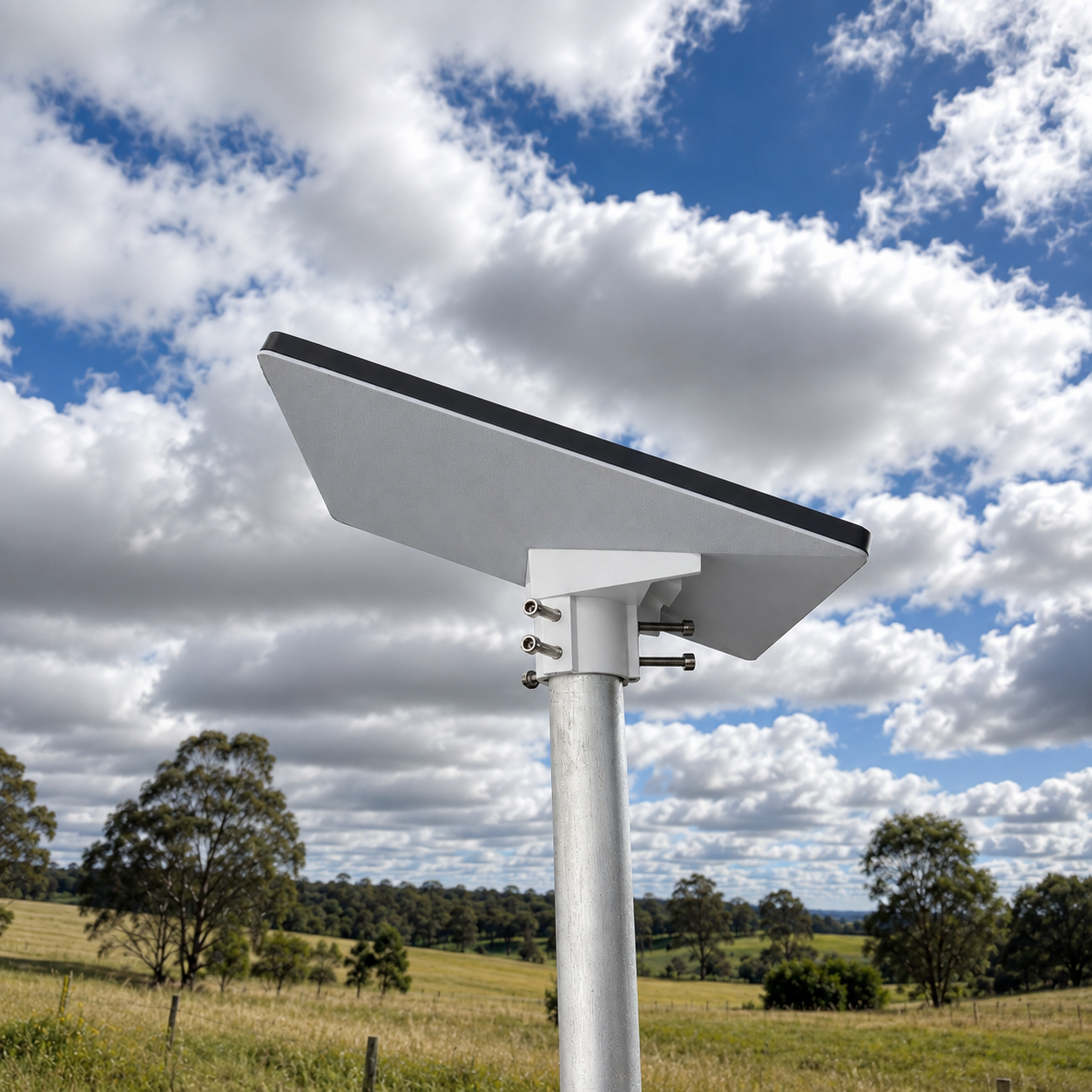 Spacetek Starlink Mini pole adaptor with six tension points installed on a galvanized pole in a rural landscape, providing a secure mounting solution for Starlink Mini installations