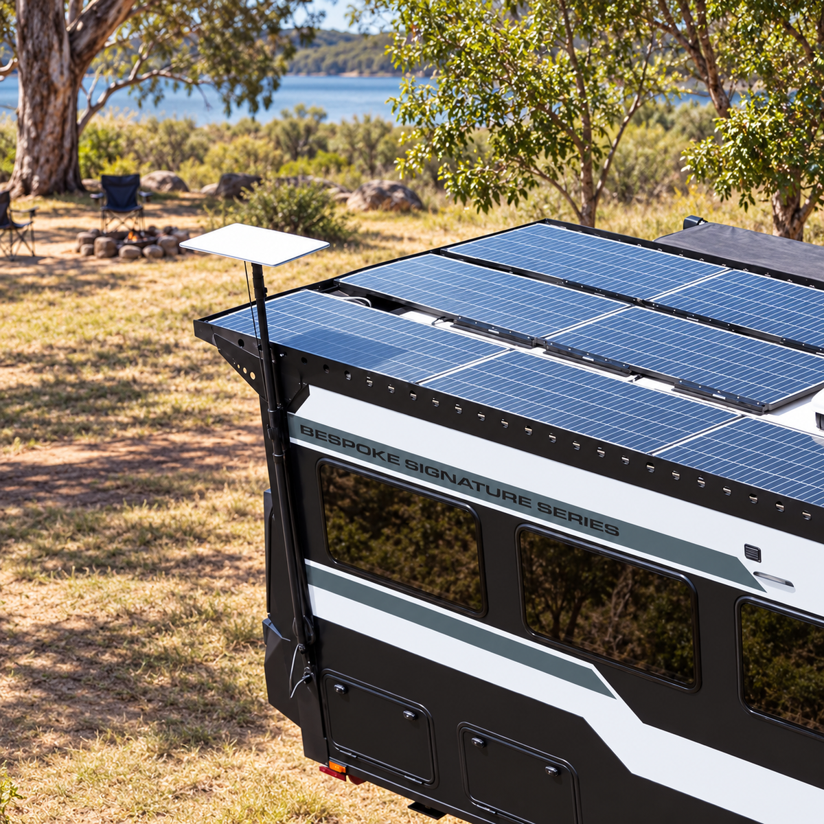 Spacetek Starlink telescopic mount holding a Starlink dish beside a solar-powered caravan at a scenic Australian campsite, providing a space-saving mounting solution without taking up valuable roof space.
