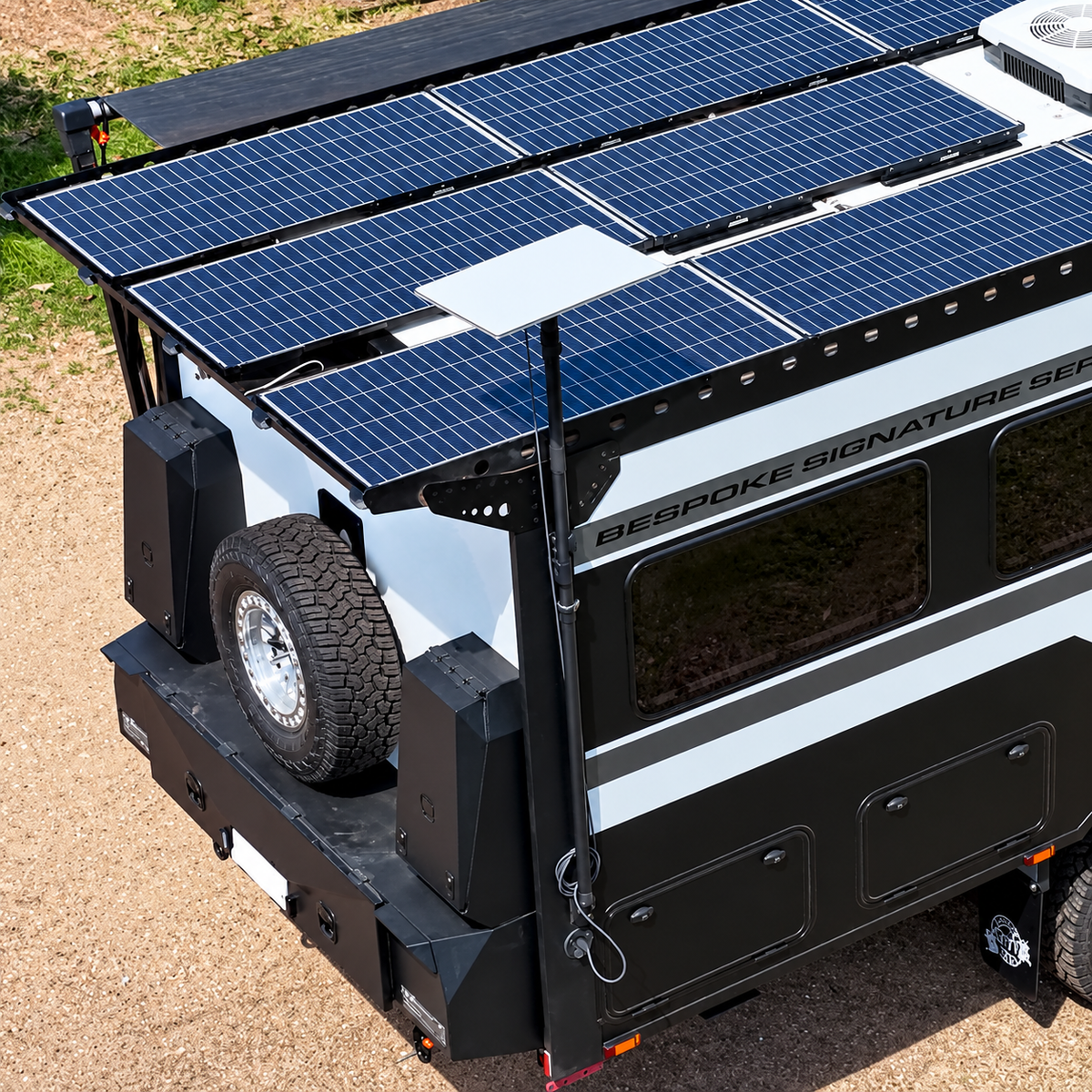 Spacetek Starlink telescopic mount installed on the rear corner of an off-road caravan, supporting a Starlink dish above a roof covered in solar panels for a neat, space-saving setup.