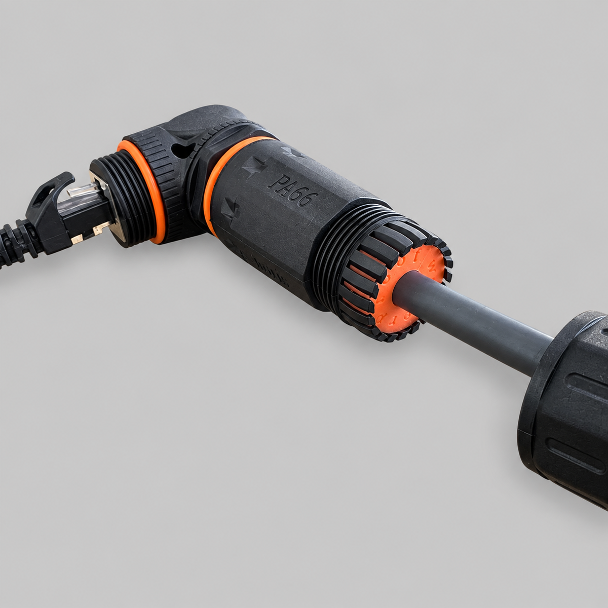 Close-up of Starlink compatible RJ45 IP68 right-angle coupler showing waterproof housing, orange seals and cable gland