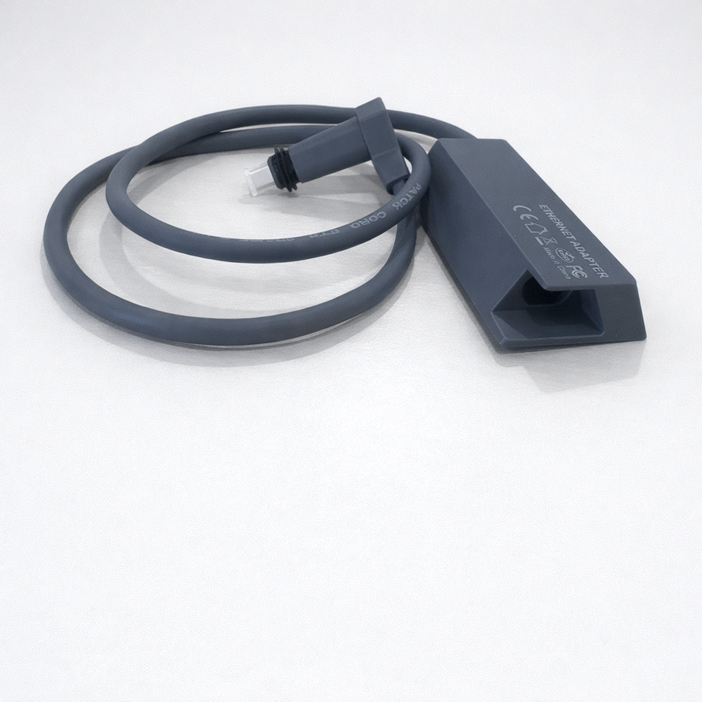 Starlink Gen 2 Ethernet Adapter with integrated cable and RJ45 connector, top angled view on neutral background