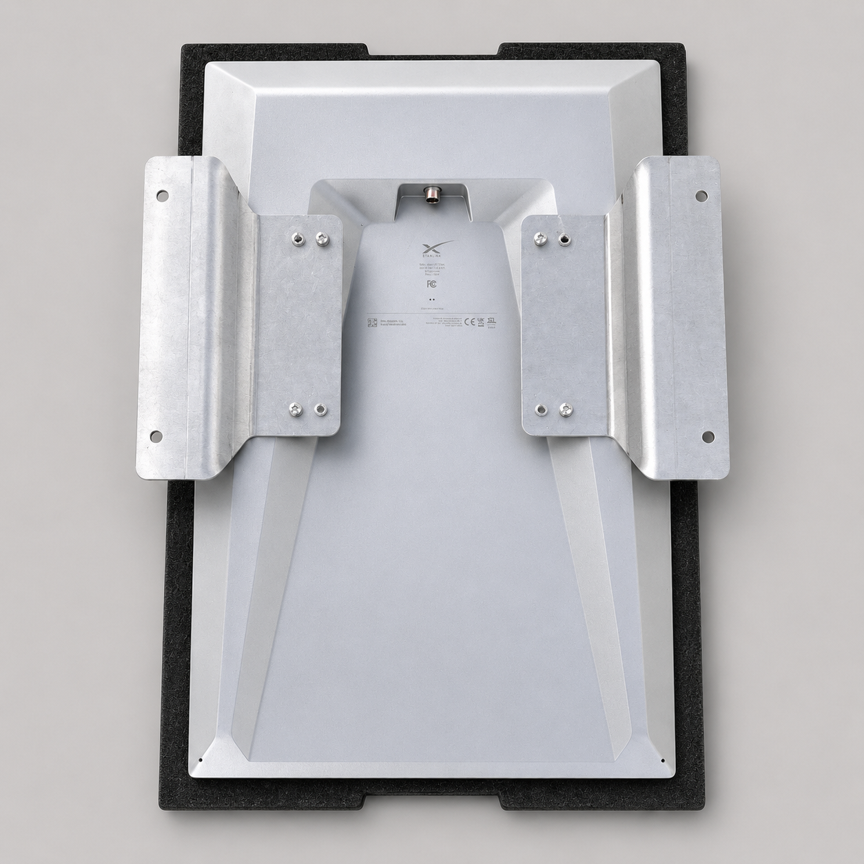 Rear installation view showing the raw aluminium flat mount adaptor fitted to a Starlink Gen 3 Performance dish