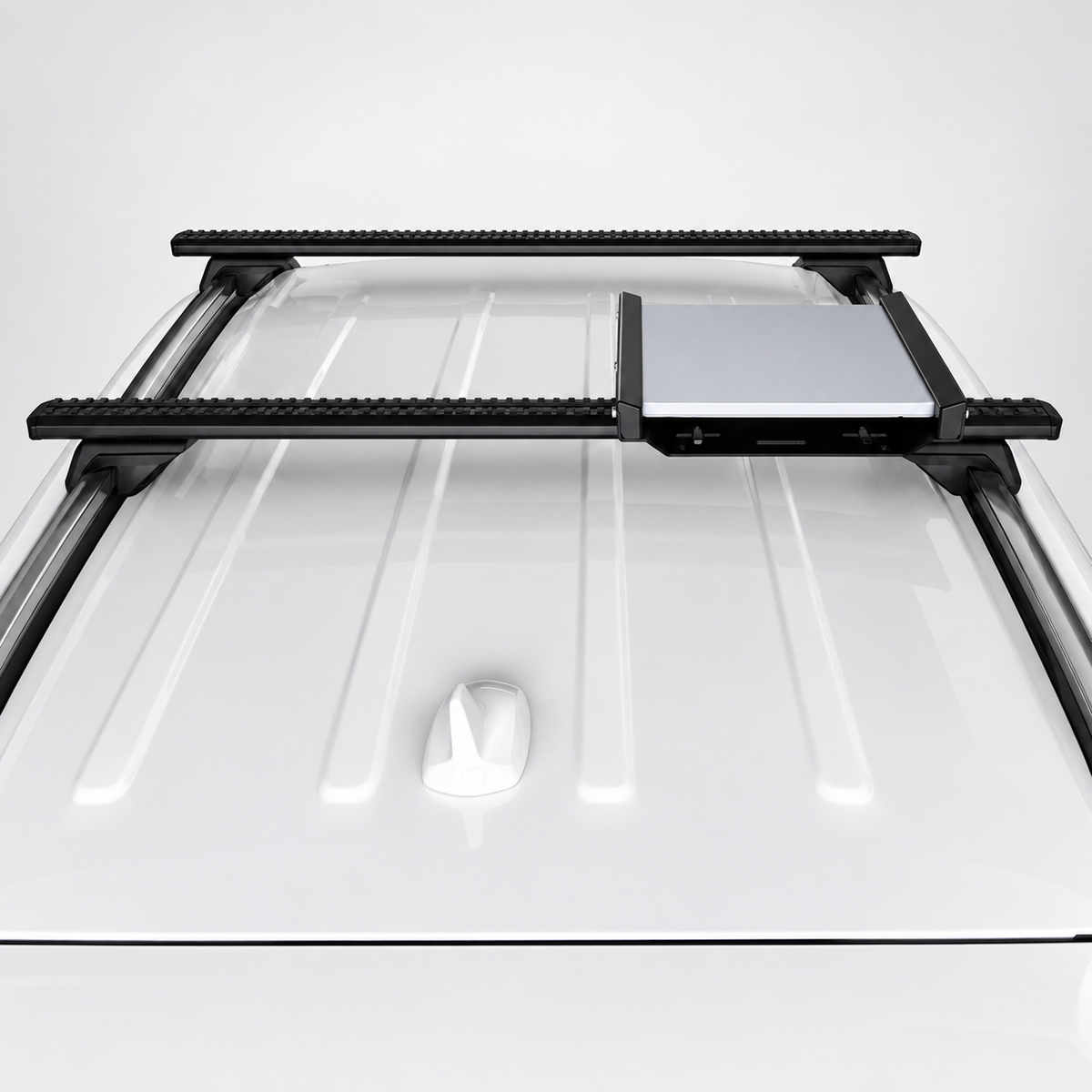 Overhead view of Starlink Mini In-Motion aluminium mount installed on vehicle roof crossbars, showing the complete roof rack setup