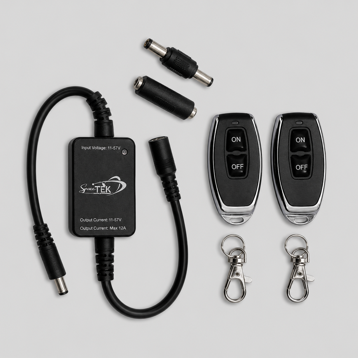 Starlink Mini in-line wireless relay kit with dual remote controls, DC relay module, adapters and key clips on grey background