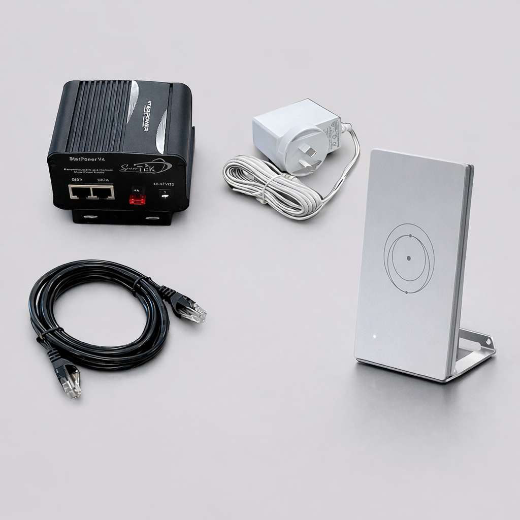 Starlink Router Mini on stand with power injector, Ethernet cable, and power supply arranged on a light grey background.