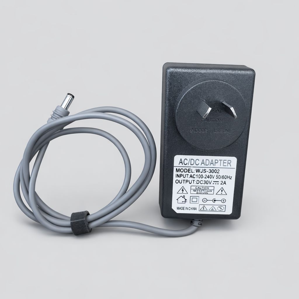 AC/DC adapter for Starlink Mini with DC cable on a grey background. 