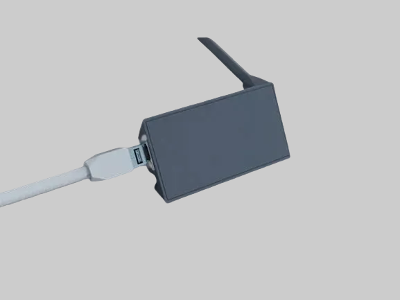 Genuine Starlink Ethernet Adaptor side view with a light background